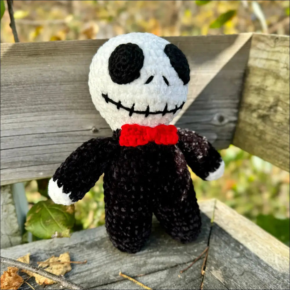 Crocheted Skellington doll with a red bow tie, perfect for Halloween fun