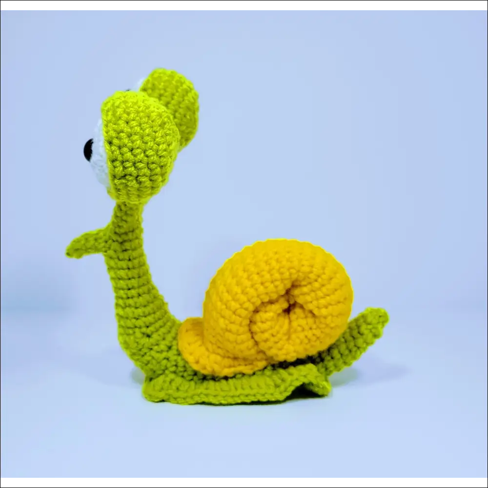 Cute crochet snail toy with a yellow shell in Green Yellow and Grey Pink colors