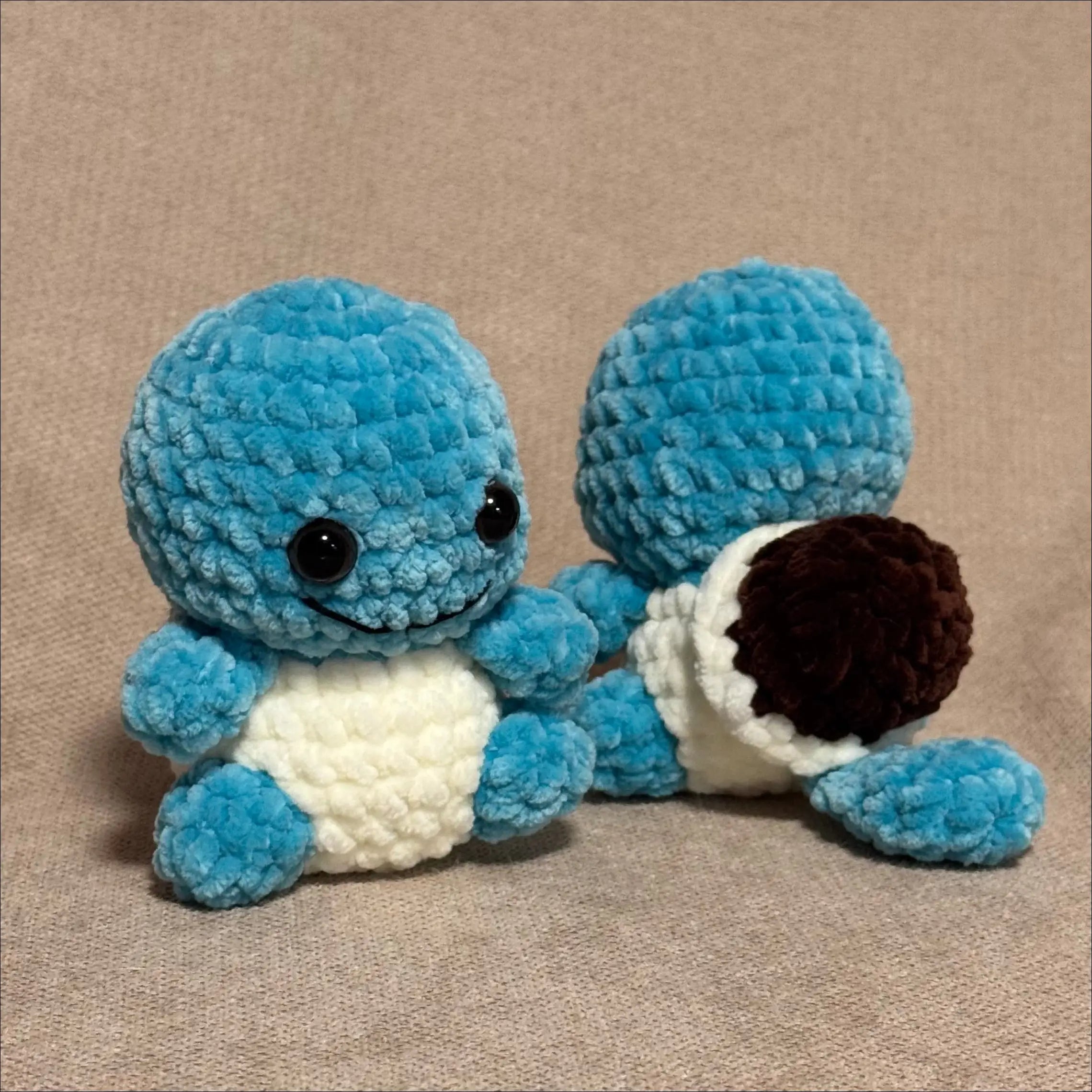 Blue plush toy resembling a character from a popular franchise on a beige background