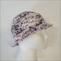 Knitted summer fun bucket hat with speckled pattern and short brim for stylish crocheters