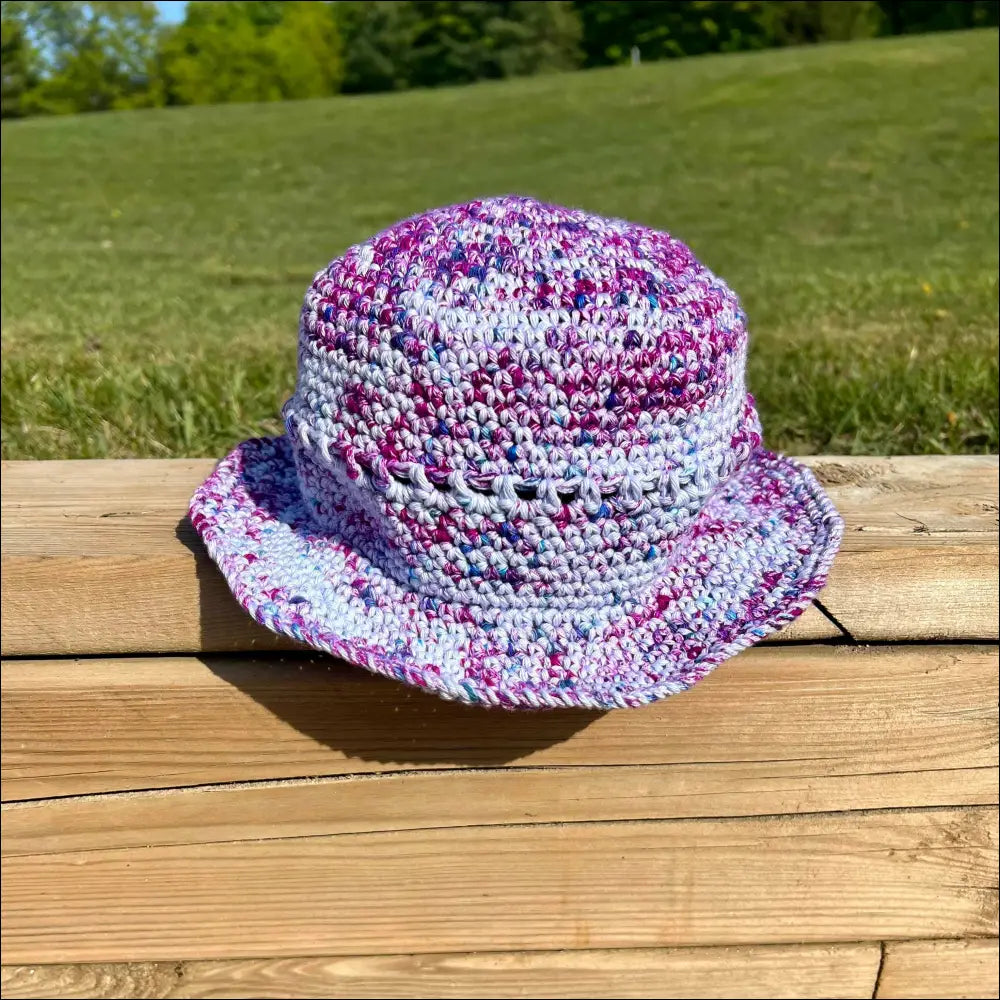 Crocheted bucket hat in purple, pink, and white from Summer Fun Bucket Hats collection