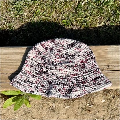 Knitted bucket hat in multicolored speckled pattern for summer fun bucket vibes