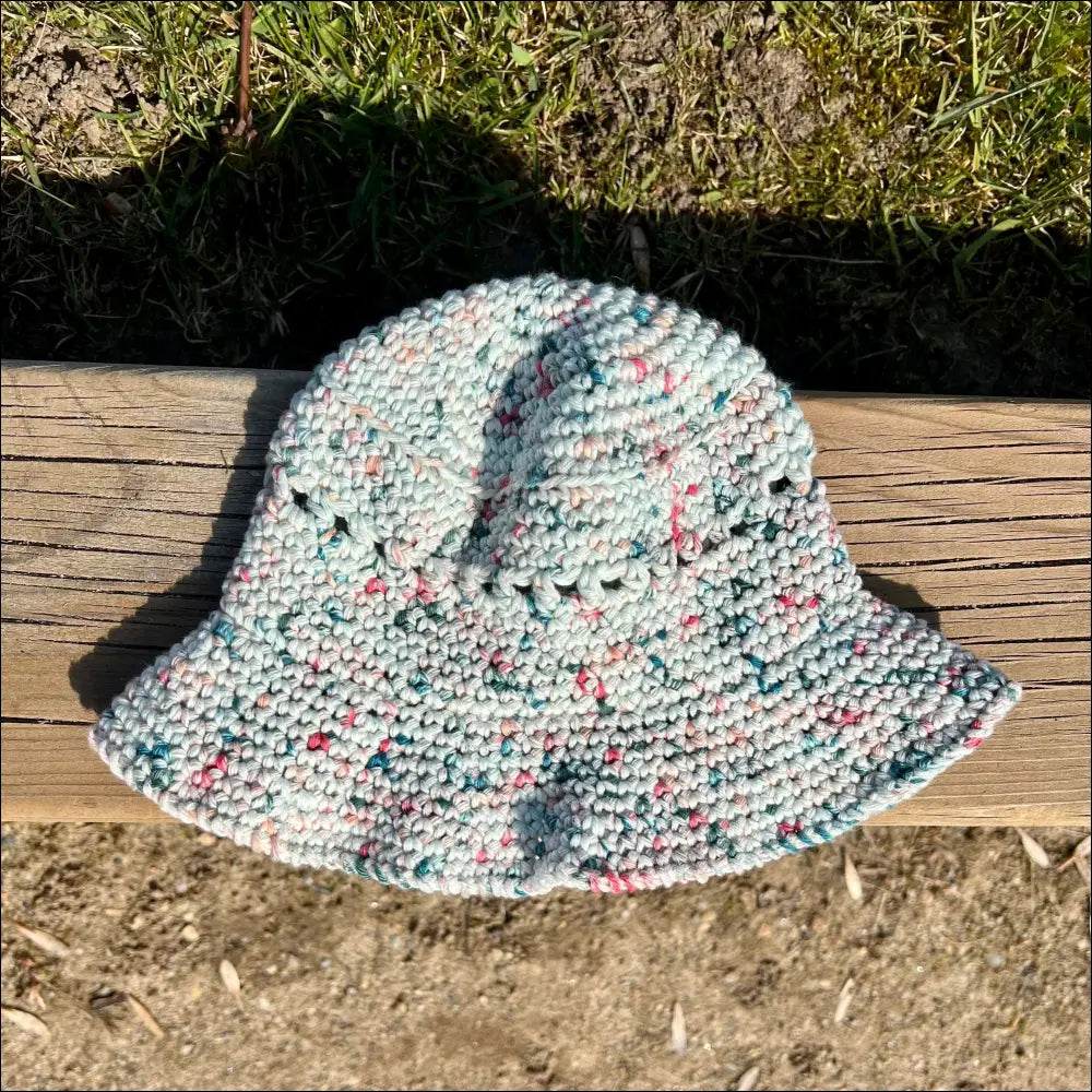 Knitted bucket hat in speckled pastel colors, perfect for Summer Fun Bucket adventures