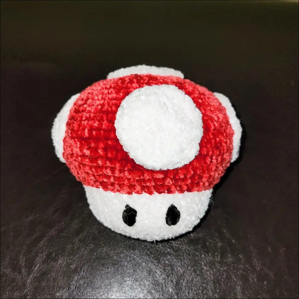 Crocheted red and white Super Mario Mushroom plush toy for nostalgic fans