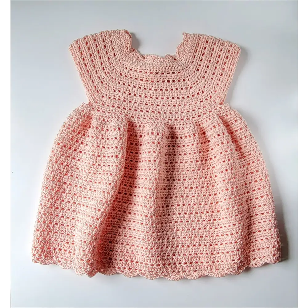 Adorable pink Sweet Cecilia Dress with short sleeves and a cute gathered skirt