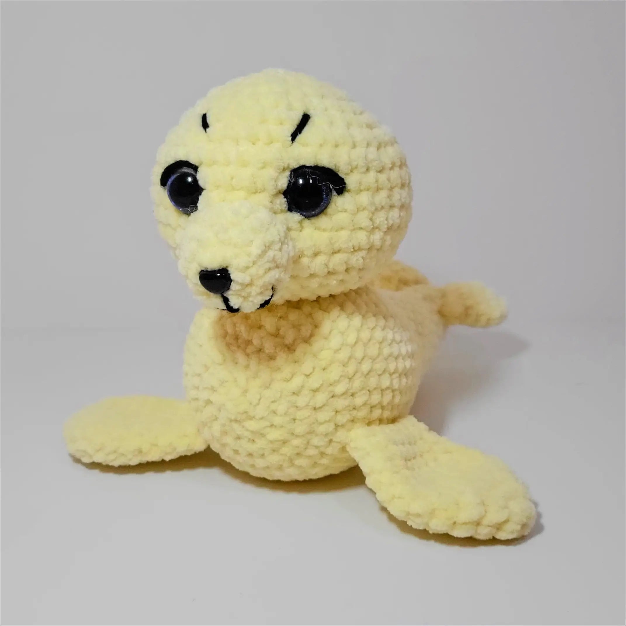 Cute stuffed seal with a black nose from Sweet Seals for endless playtime fun
