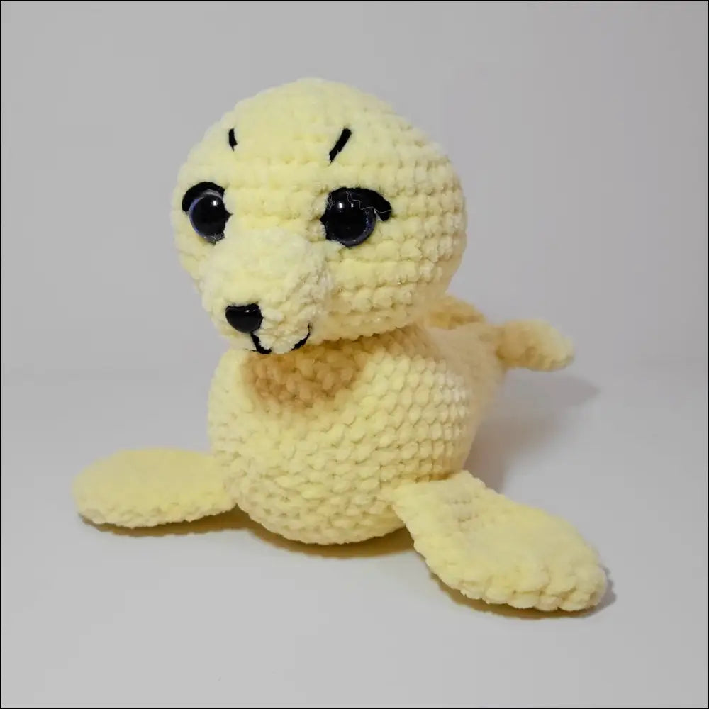 Cute stuffed seal with a black nose from Sweet Seals for endless playtime fun