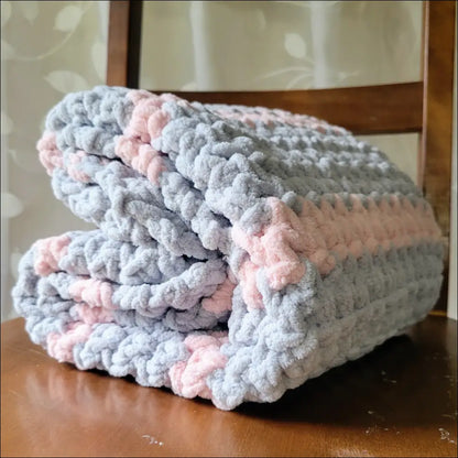 Crocheted Sweet Stripes Baby Blanket in soft gray and pink for cozy moments