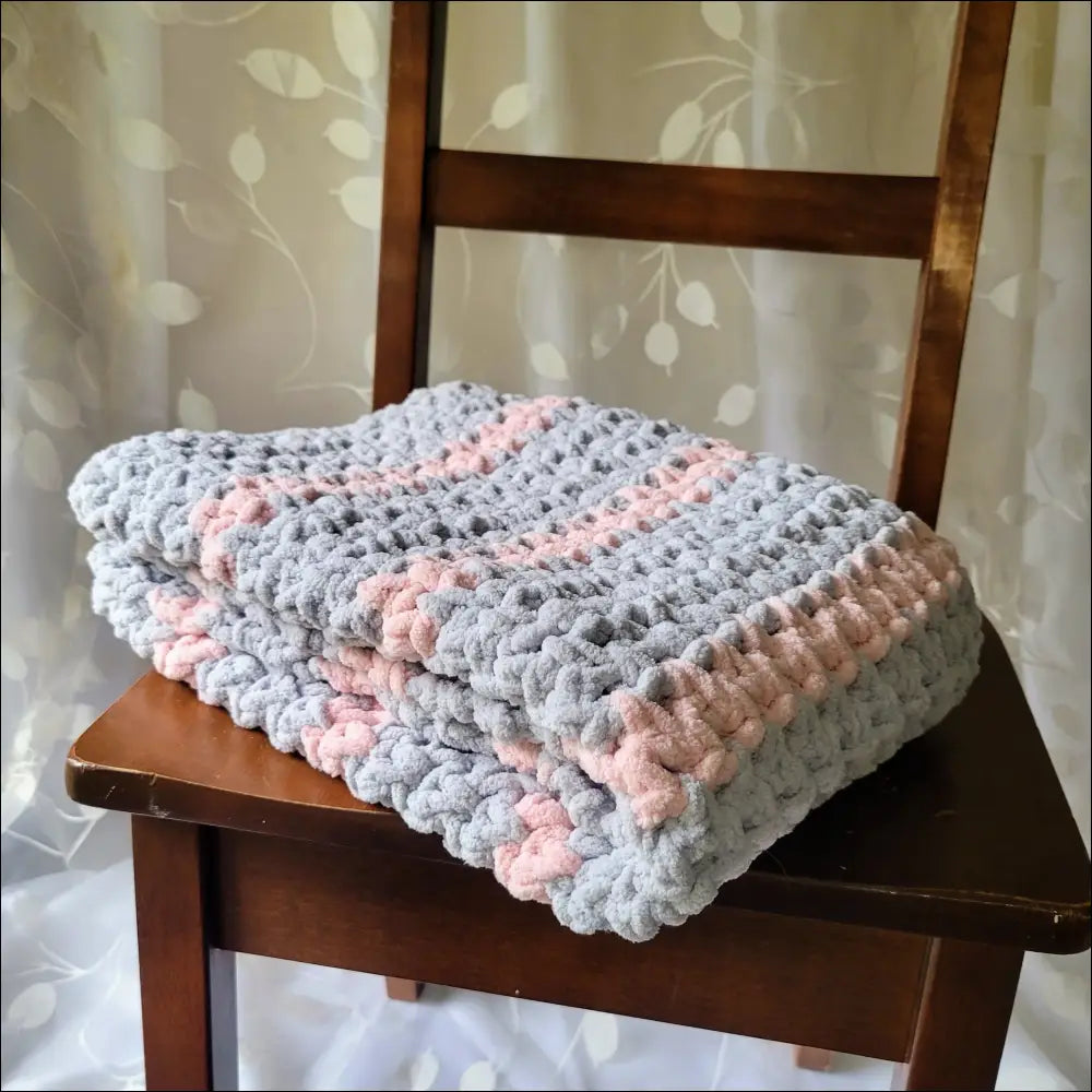 Crocheted Sweet Stripes Baby Blanket with cozy gray and pink zigzag stripes