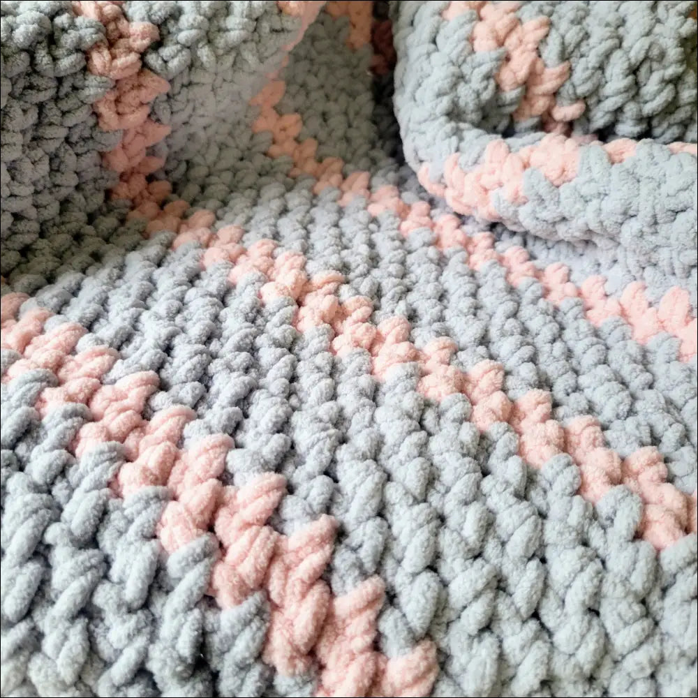 Knitted Sweet Stripes Baby Blanket in cozy gray and pink yarn for little ones