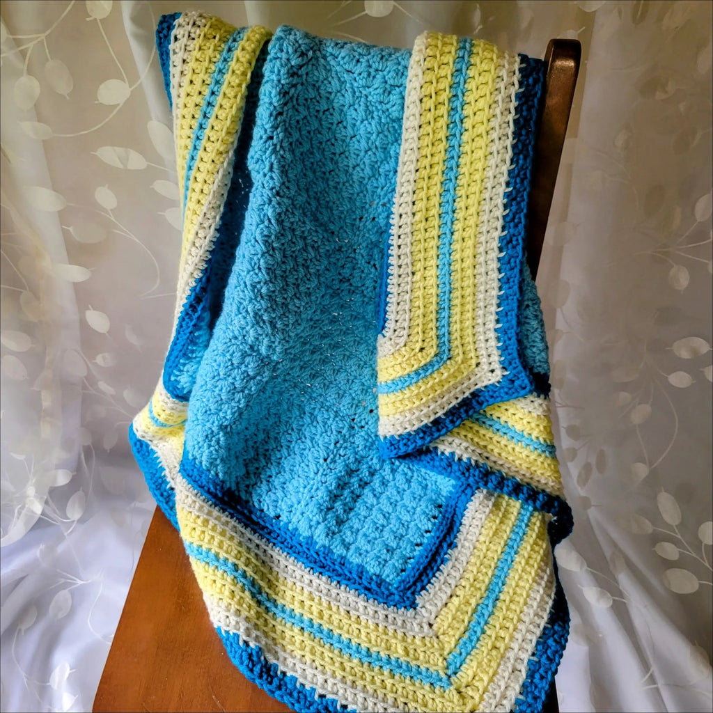 Textured Baby Blanket with blue, yellow, and white stripes in a fun geometric design