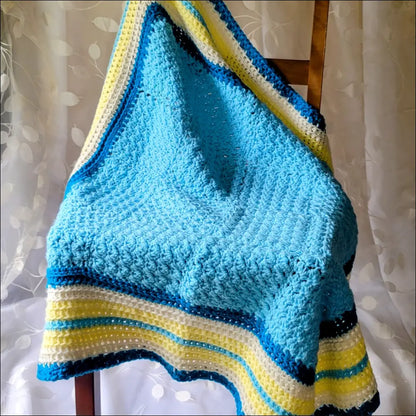 Textured baby blanket in blue with yellow and navy stripes for cozy comfort