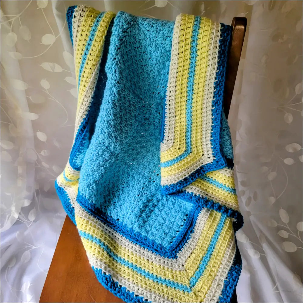 Textured Baby Blanket with blue, yellow, and white stripes in a fun geometric design