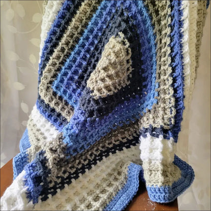 Waffle Baby Blanket featuring cozy blue, white, and gray geometric patterns