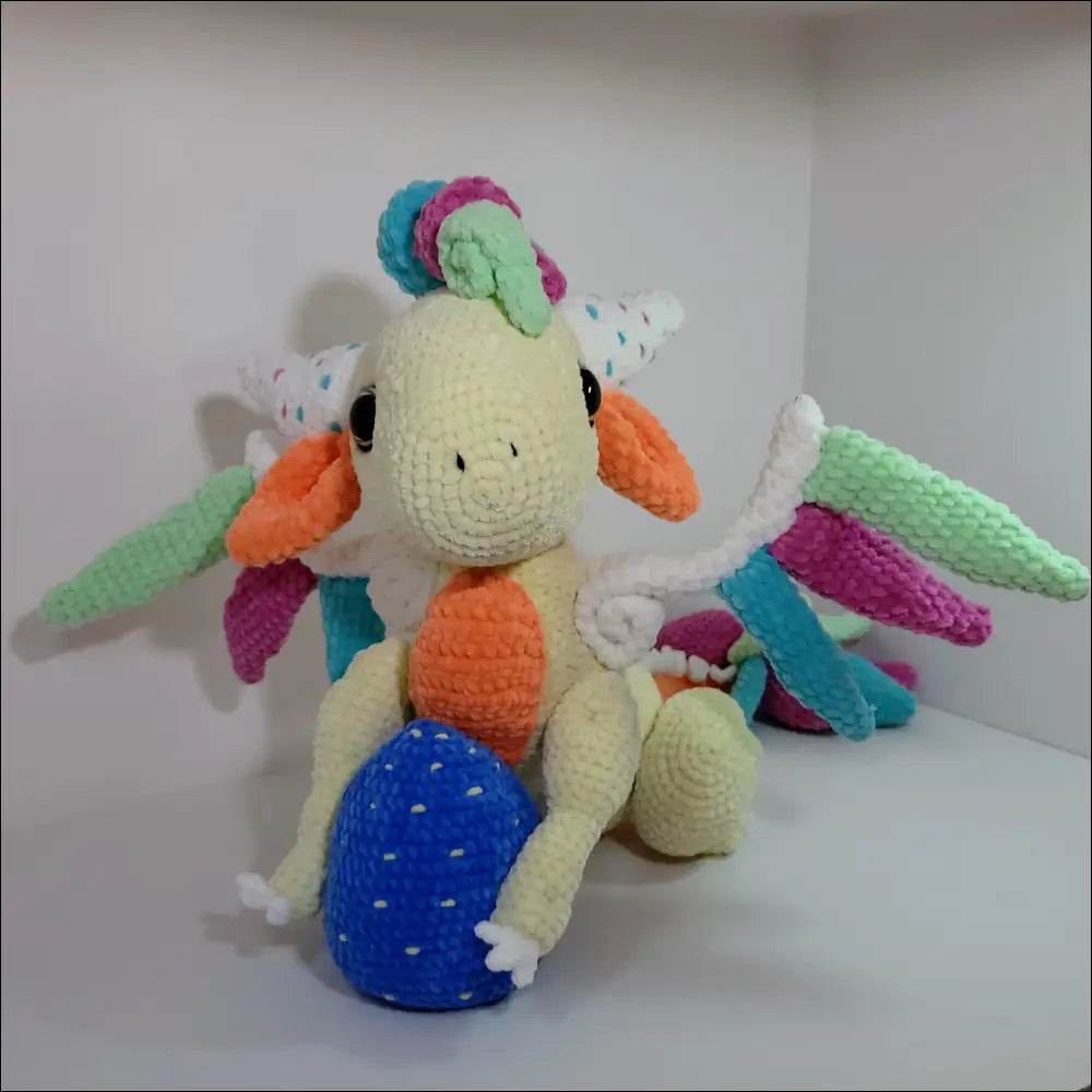 Cute Winged Dragon Plush perched on a table, ready for magical adventures and play