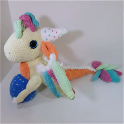 Small Winged Dragon Plush on a table, perfect for magical adventures and playtime fun