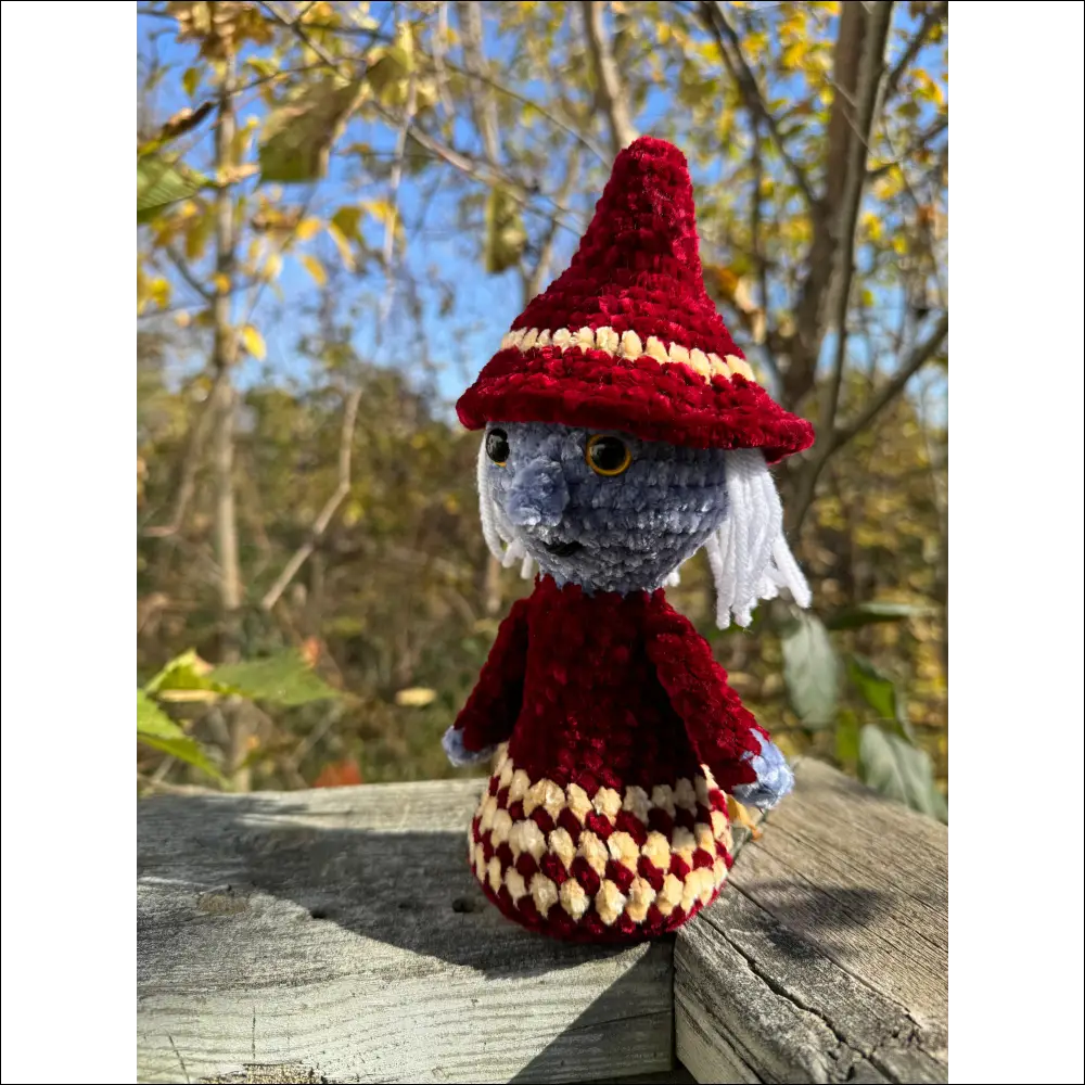 Crocheted doll in red hat and dress perfect for Purple Plush Witches Halloween decor