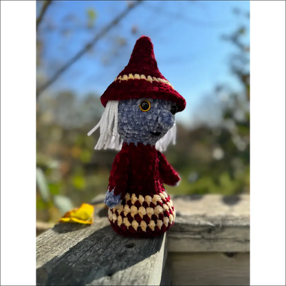 Crocheted gnome in a red hat, perfect for Purple Plush Old Witches Halloween decor